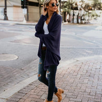 Open vest in oversized vleermuisbreisel